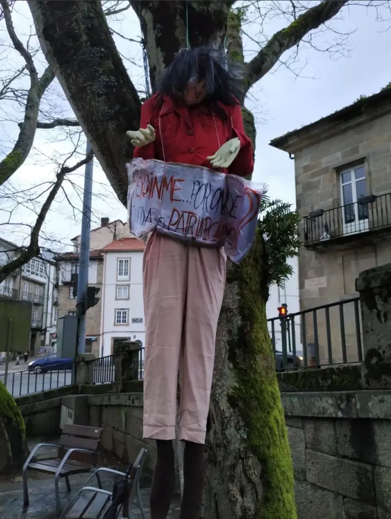 Photo of a woman hung in effigy from Women are Human