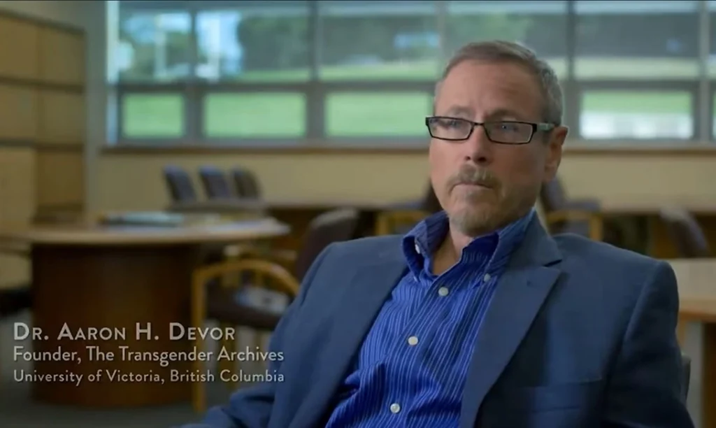 aaron h devor founder of the transgender archives chair of transgender studies at university of victoria which was created due to funding from the Pritzkers.
Aaron is a small woman who looks like a man, she has a well-trimmed beard and wears a suit and jacket