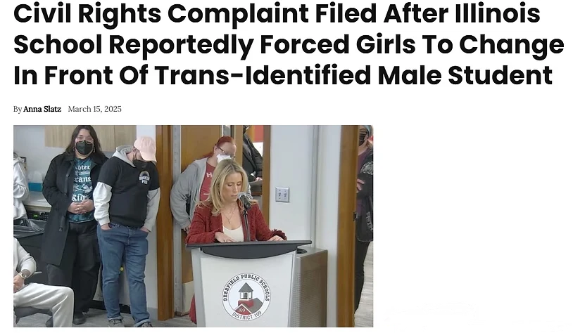 A screenshot of a news article. The bold black headline reads: "Civil Rights Complaint Filed After Illinois School Reportedly Forced Girls To Change In Front Of Trans-Identified Male Student." Below the headline, a byline reads "By Anna Slatz" followed by "March 15, 2025." Below the byline is a photograph of a woman with blonde hair wearing a red cardigan, speaking into a microphone at a wooden podium bearing a circular school district emblem (partially legible text includes "DEERFIELD PUBLIC SCHOOLS" and "DISTRICT 109"). Behind her, several other adults stand near a doorway, one wearing a face mask and a shirt with partially visible text, another wearing a baseball cap and a T-shirt reading "PROTECT TRANS KIDS" with a knife between "PROTECT" and "TRANS" and a long stemmed rose between "TRANS" and "KIDS"